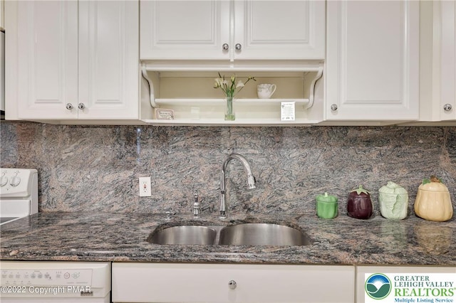 kitchen featuring a sink, white cabinets, open shelves, and backsplash