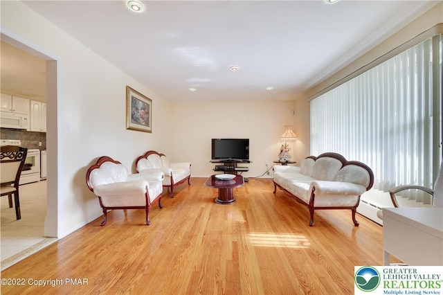 living area featuring recessed lighting and light wood-type flooring