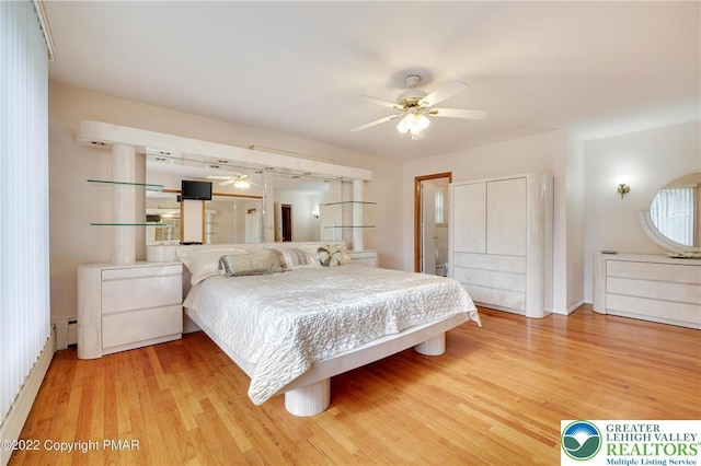 bedroom featuring a ceiling fan and light wood-style floors