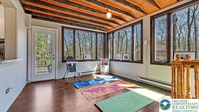 exercise room with wood ceiling, a baseboard radiator, baseboards, and wood finished floors
