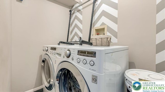 laundry room featuring washing machine and dryer