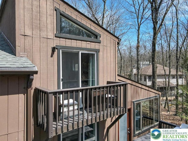 exterior space with a shingled roof