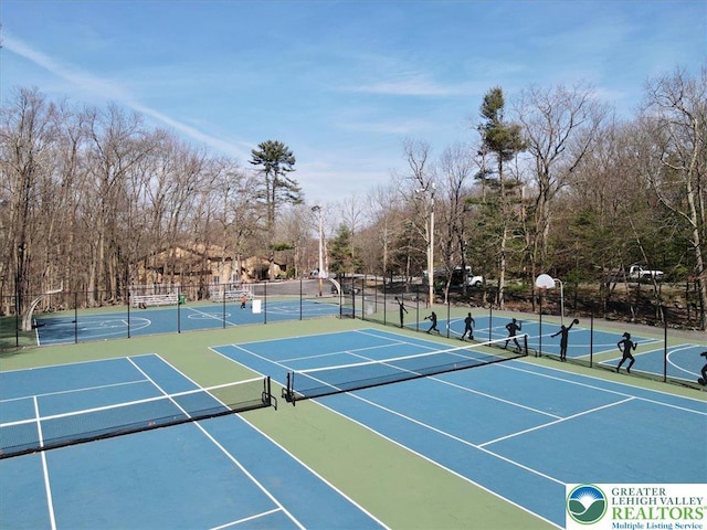 view of sport court with community basketball court and fence