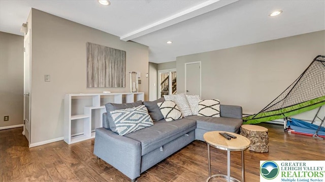 living room with baseboards, beamed ceiling, recessed lighting, and wood finished floors
