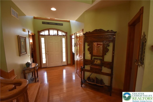 entrance foyer with visible vents, recessed lighting, and wood-type flooring