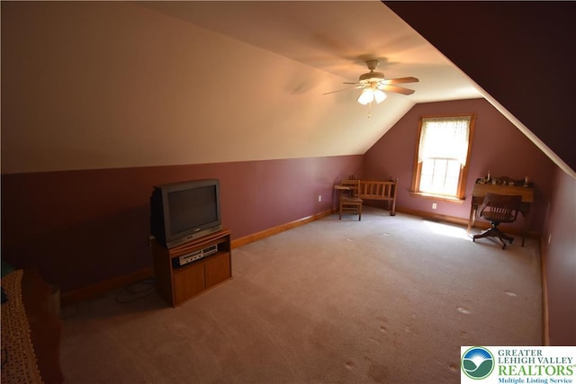 additional living space with baseboards, a ceiling fan, lofted ceiling, and light carpet