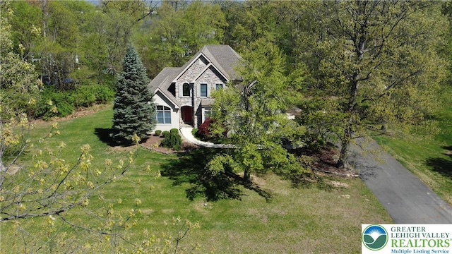 exterior space with a wooded view