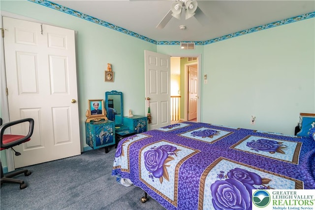 bedroom featuring carpet floors, a ceiling fan, and visible vents