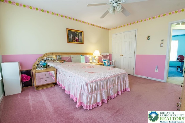carpeted bedroom with baseboards, ceiling fan, and a closet