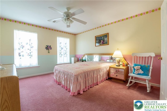 carpeted bedroom featuring visible vents, a ceiling fan, baseboards, and multiple windows