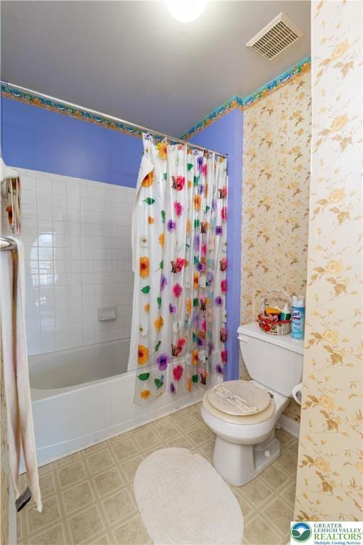 full bath featuring toilet, tile patterned floors, visible vents, and shower / bathtub combination with curtain