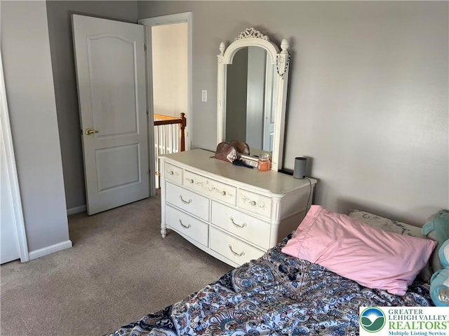 carpeted bedroom with baseboards