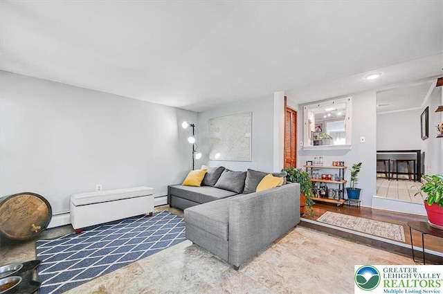 living area with recessed lighting and a baseboard radiator