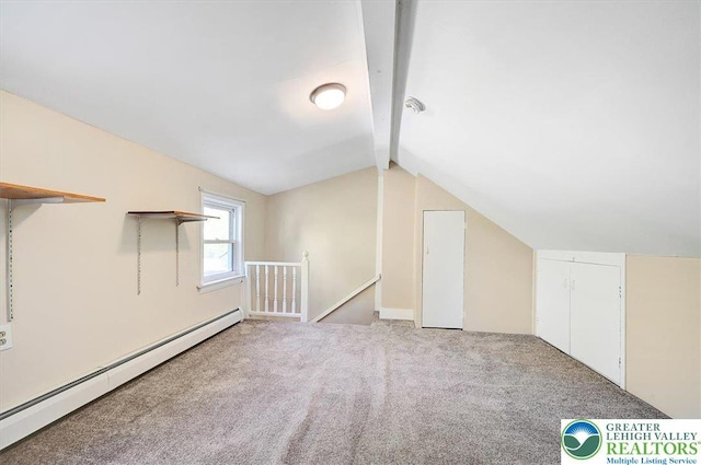 bonus room featuring a baseboard heating unit, vaulted ceiling with beams, and carpet
