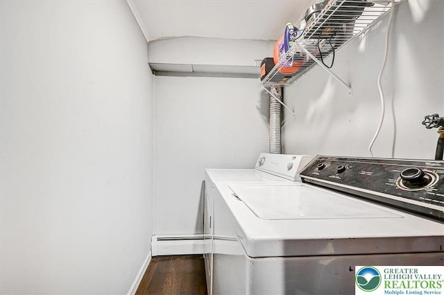 washroom featuring baseboards, laundry area, dark wood finished floors, and washer and clothes dryer