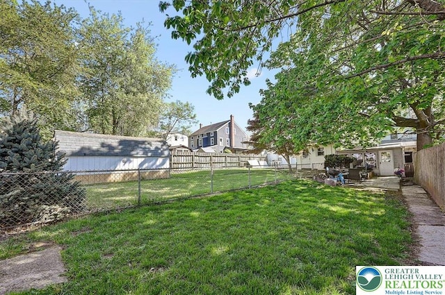 view of yard featuring a fenced backyard and a patio