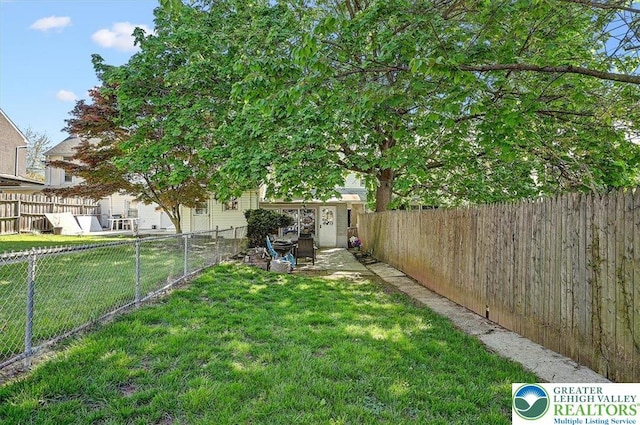 view of yard with a fenced backyard