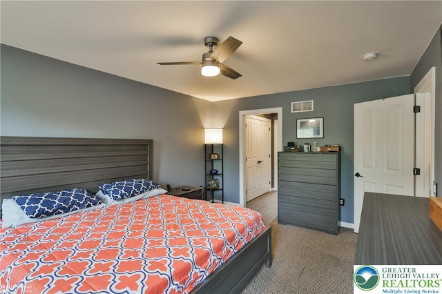bedroom with carpet floors, baseboards, ceiling fan, and visible vents