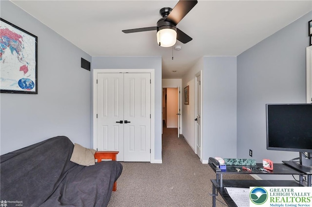 interior space with a ceiling fan, baseboards, and visible vents