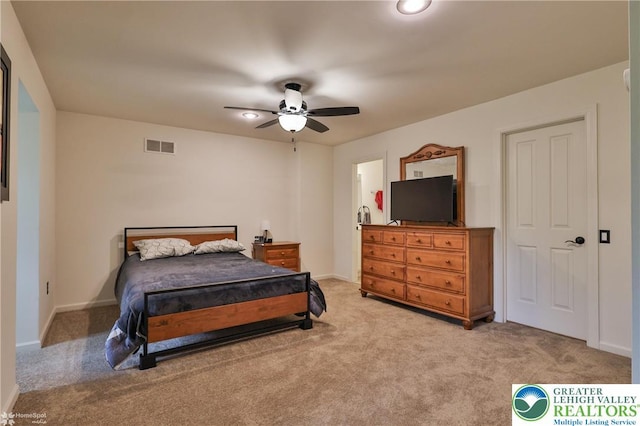 bedroom featuring a ceiling fan, baseboards, visible vents, and light carpet