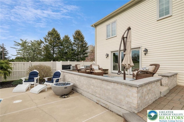 view of patio / terrace featuring an outdoor living space and fence private yard