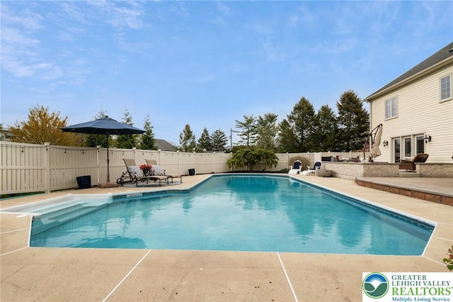 view of pool with a patio, a fenced in pool, and a fenced backyard