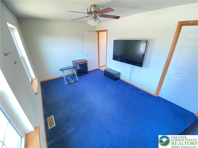 178 Stoney Ledge Dr, Jackson Twp, PA 18360 - carpeted living area with baseboards and ceiling fan