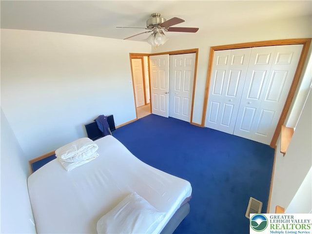 178 Stoney Ledge Dr, Jackson Twp, PA 18360 - bedroom featuring multiple closets, ceiling fan, and carpet flooring