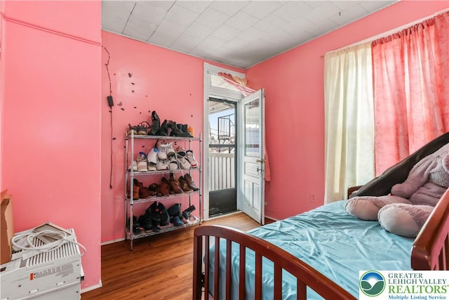 bedroom with wood finished floors
