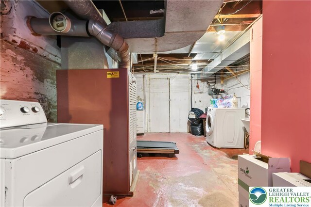 unfinished basement featuring independent washer and dryer