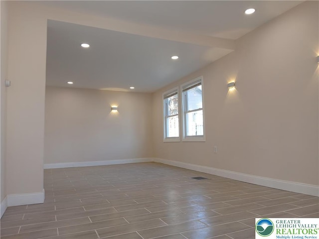 unfurnished room with recessed lighting, baseboards, and visible vents