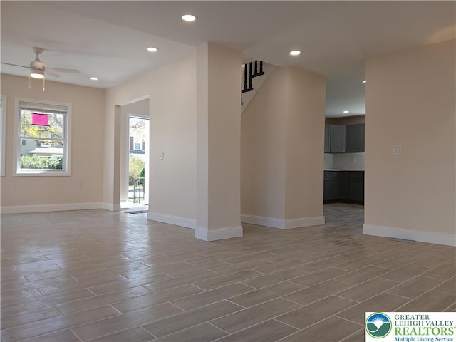spare room featuring baseboards, a ceiling fan, recessed lighting, and wood finish floors
