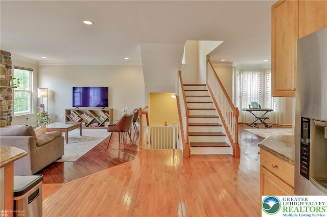 interior space featuring recessed lighting, ornamental molding, and hardwood / wood-style flooring