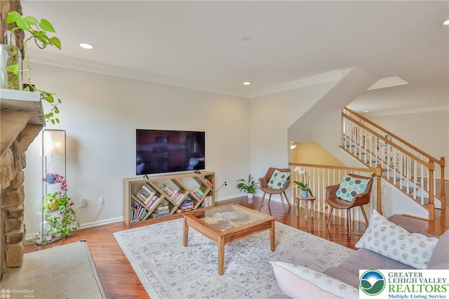 living area with recessed lighting, baseboards, stairs, crown molding, and wood finished floors