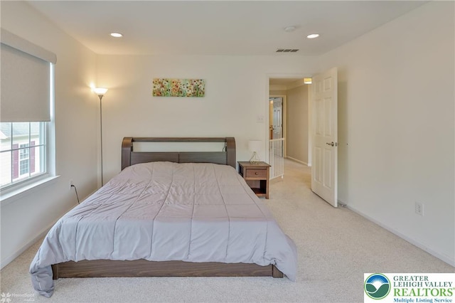 bedroom with baseboards, recessed lighting, visible vents, and carpet floors