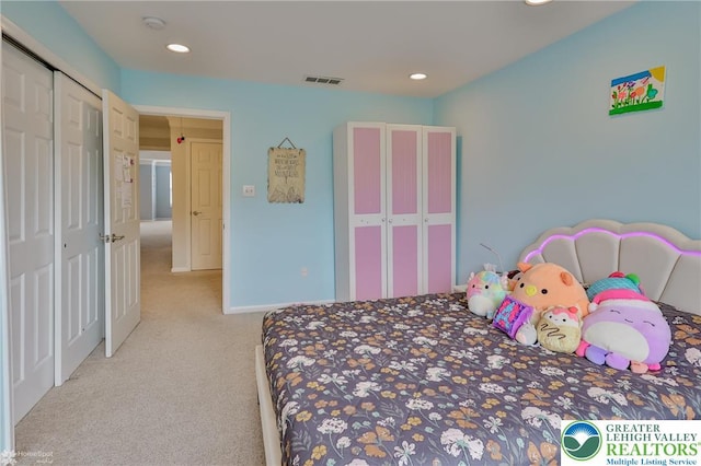 carpeted bedroom featuring a closet, visible vents, baseboards, and recessed lighting