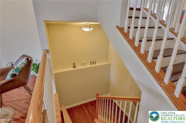 stairs with wood finished floors