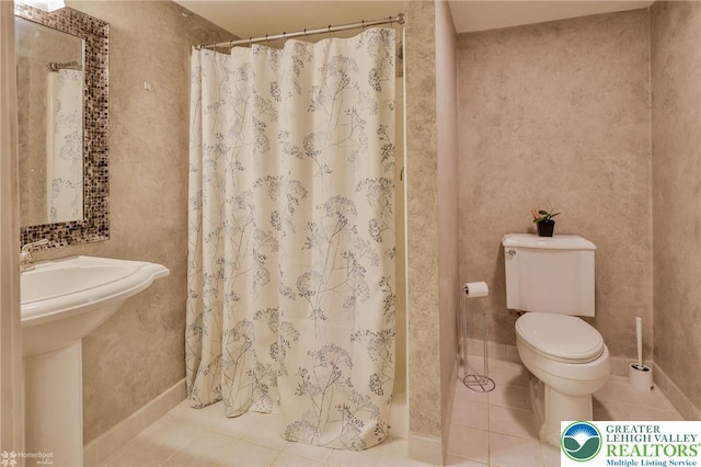 full bathroom with toilet, a shower with curtain, and tile patterned floors