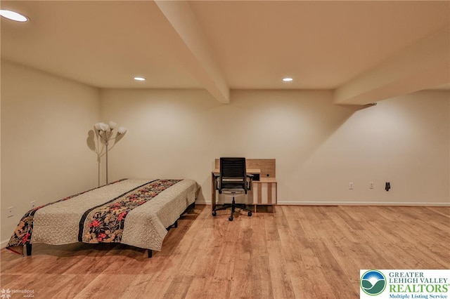 bedroom featuring baseboards, beamed ceiling, recessed lighting, and wood finished floors