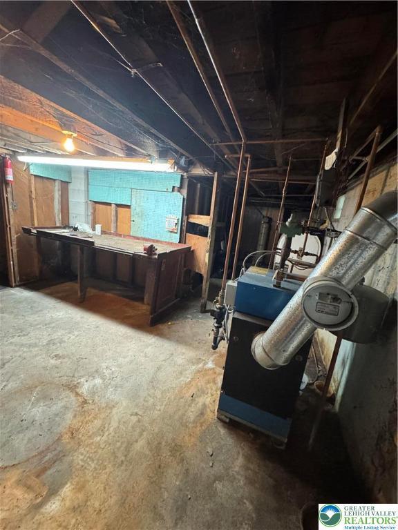 unfinished below grade area with a workshop area
