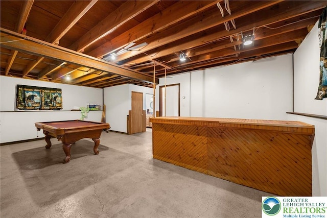 game room with a bar, billiards, and concrete flooring