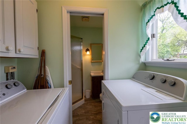 laundry area with a sink, cabinet space, and washer and dryer