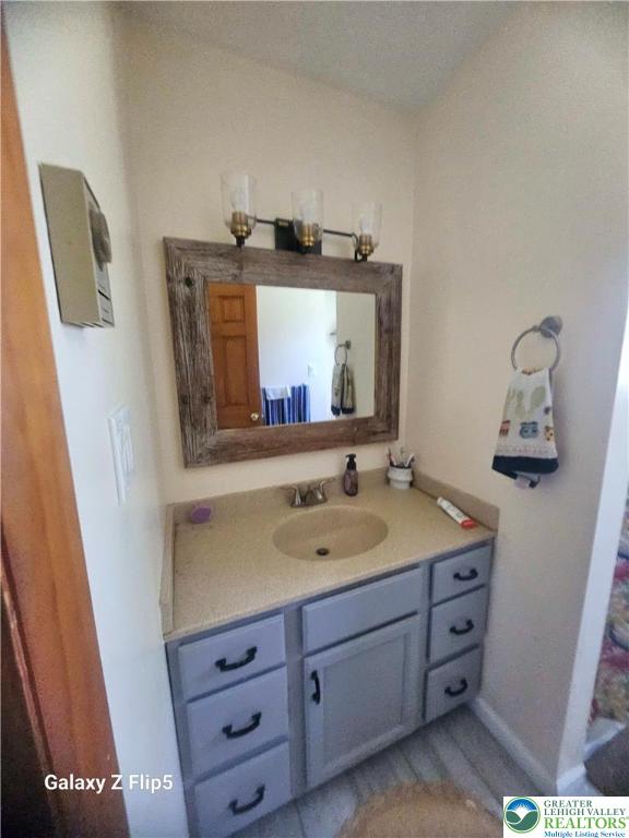 bathroom featuring vanity and baseboards