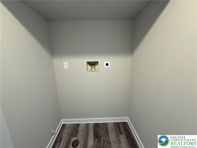 clothes washing area with laundry area, baseboards, hookup for a washing machine, dark wood-style floors, and electric dryer hookup