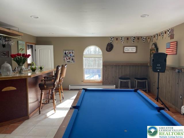 recreation room with billiards, light tile patterned floors, and baseboard heating