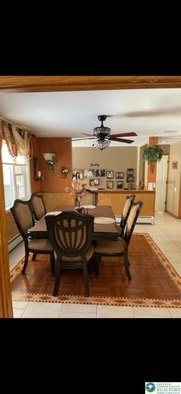 dining area with ceiling fan, light tile patterned floors, and baseboard heating