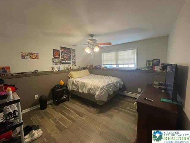 bedroom with baseboards, a ceiling fan, and wood finished floors