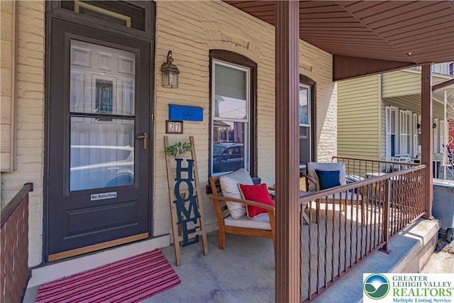 doorway to property with a porch
