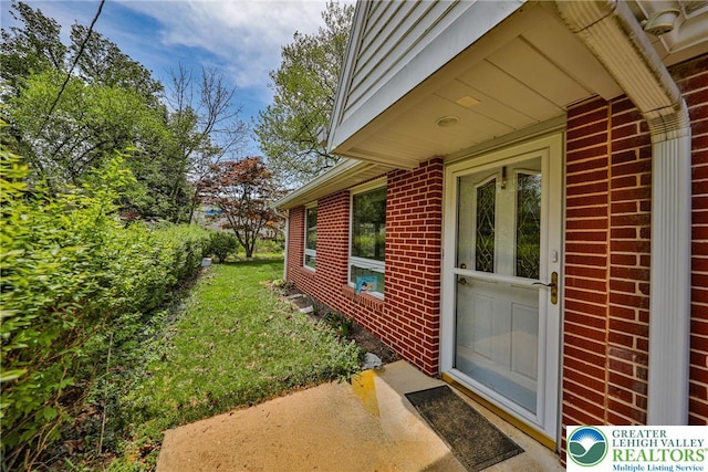 exterior space featuring brick siding