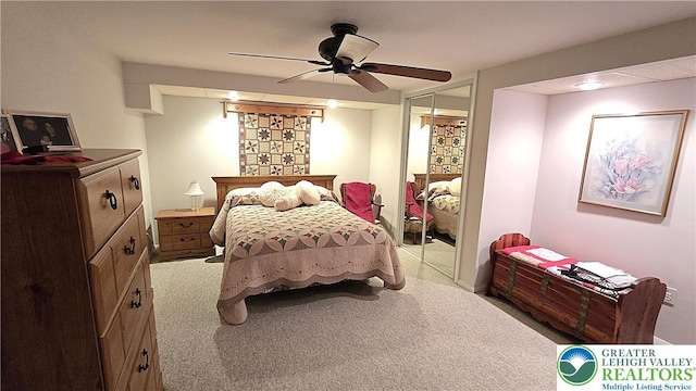 bedroom featuring carpet floors, a ceiling fan, and a closet